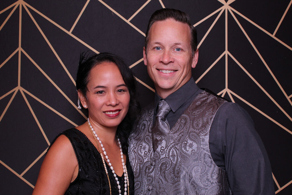 A smiling couple at the Gatsby Party