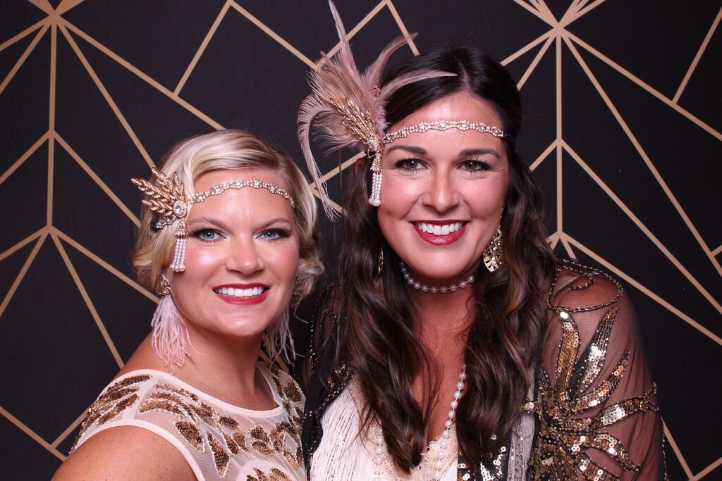 Two friends in feathered headbands